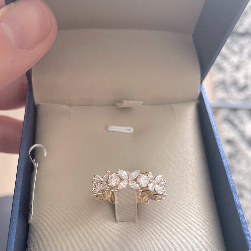 Victoria designs moissanite and yellow gold eternity band